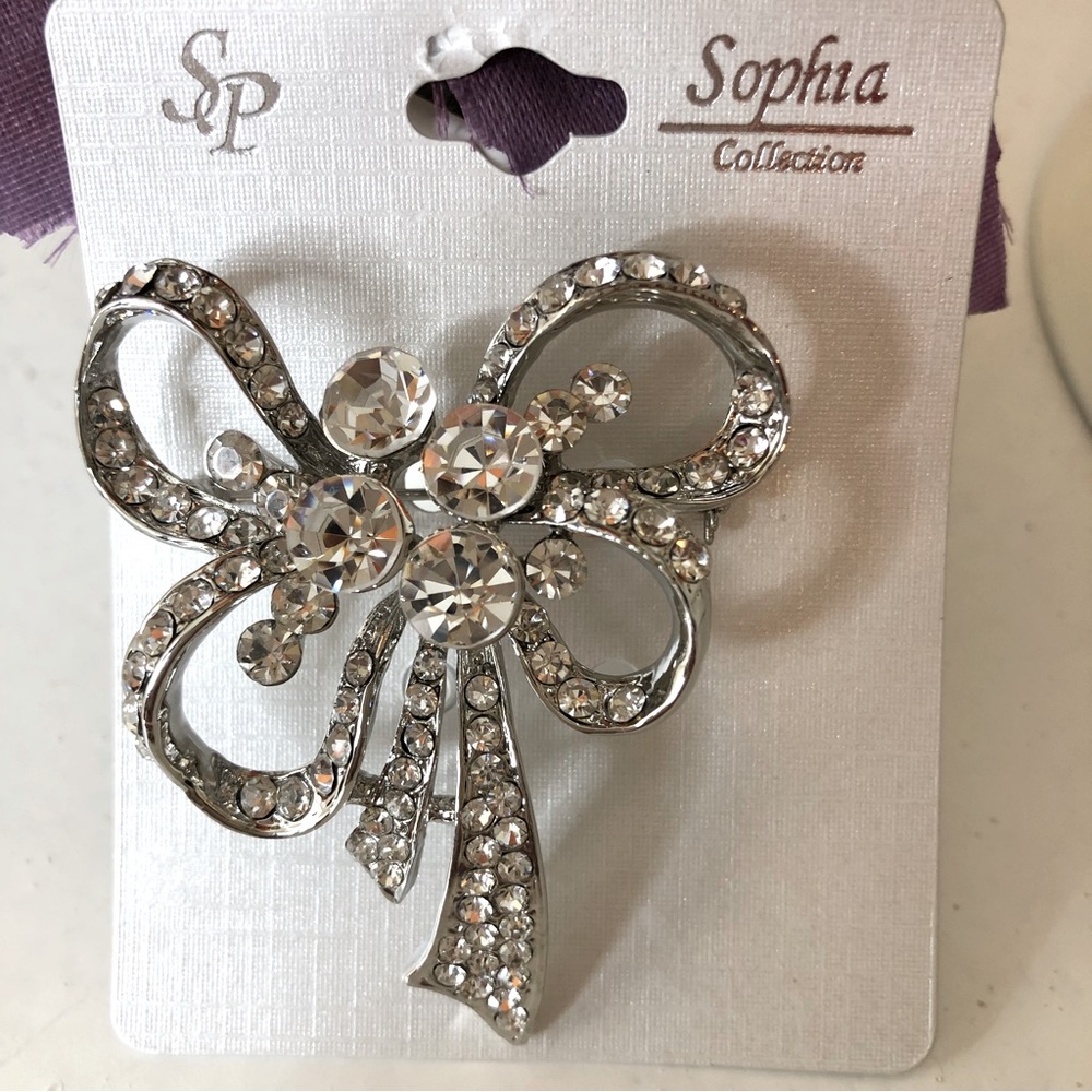 Sophia collection.  Jewelry bow brooch, vintage style, silver color.